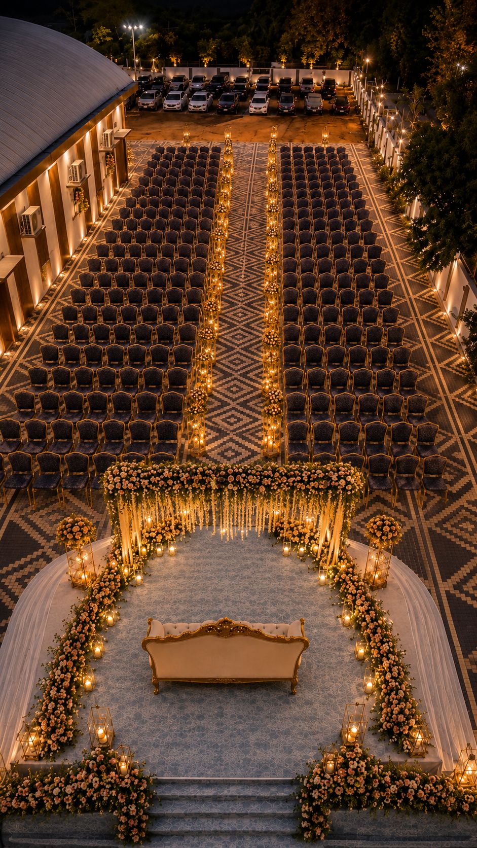 Open-air reception stage and seating setup at night